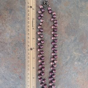 11” sterling with purple teardrop shaped natural stones.